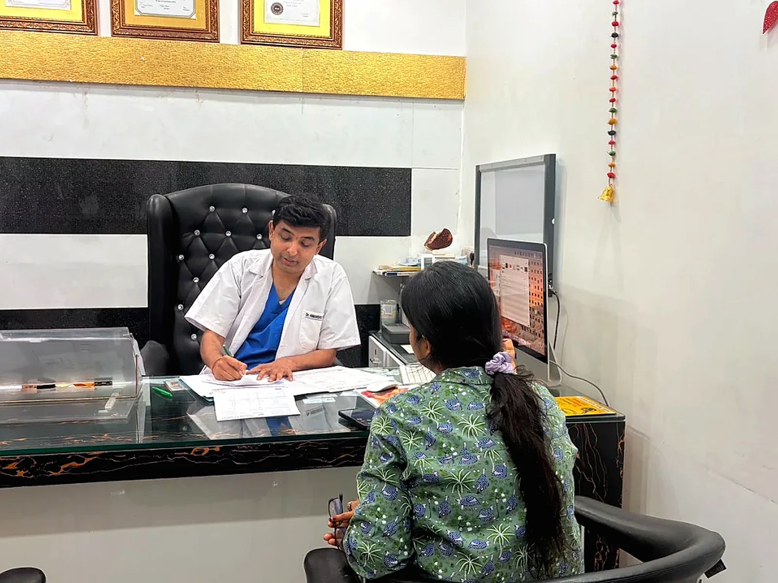 Dr. Himanshu Yadav explaining information during a consultation